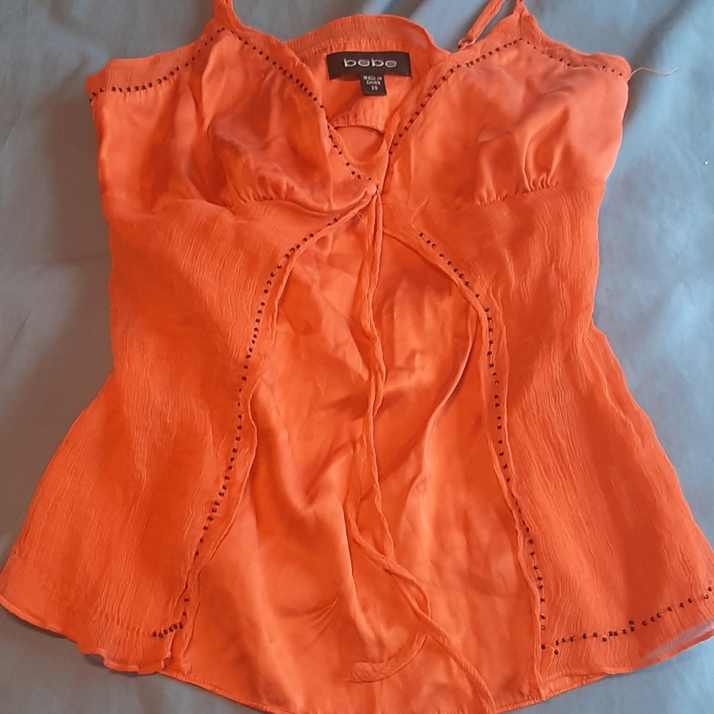 A orange flowy shirt